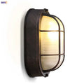 Industrial black wall lamp with ribbed glass for stairway lighting