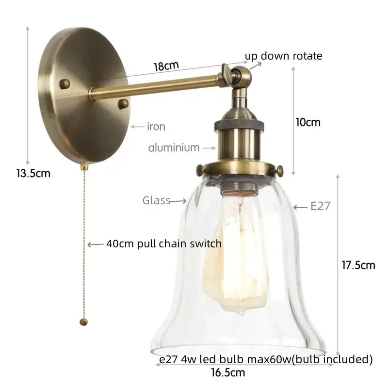 Industrial brass and clear glass wall sconce for bedroom