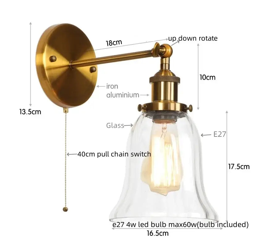 Industrial brass and clear glass wall sconce for bedroom