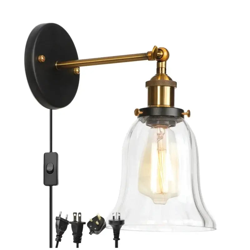 Industrial brass and clear glass wall sconce for bedroom