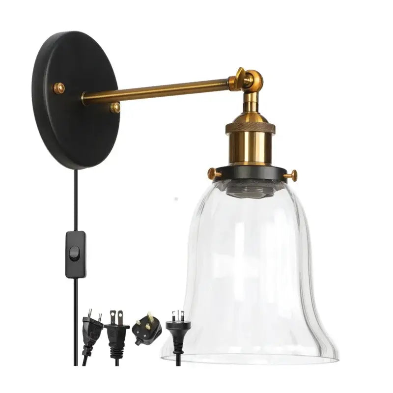 Industrial brass and clear glass wall sconce for bedroom