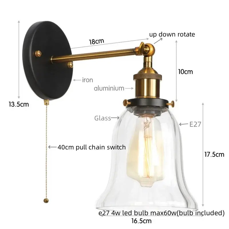 Industrial brass and clear glass wall sconce for bedroom
