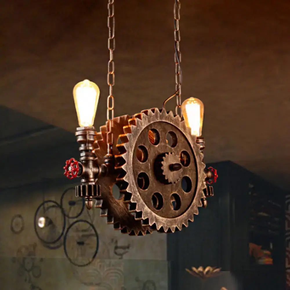 Industrial brass gear pendant light dining room with red accents
