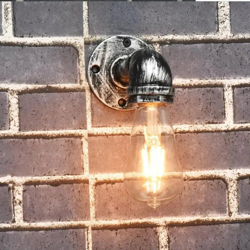 Industrial brass pipe wall sconce bedroom filament bulb light