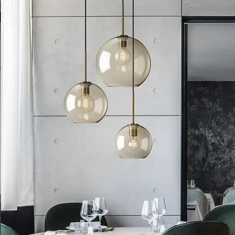 Industrial smoked glass and brass pendant light – dining room