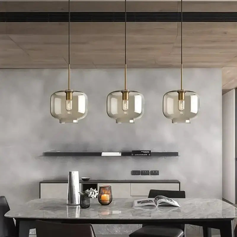 Industrial smoked glass and brass pendant light – dining room