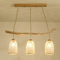 Lodge style wood pendant light with rattan shades for dining room