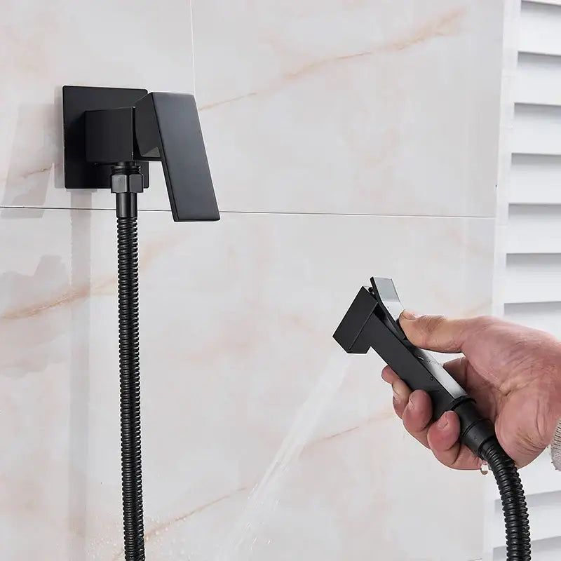 Matte black brass bidet faucet with handheld spray for bathroom