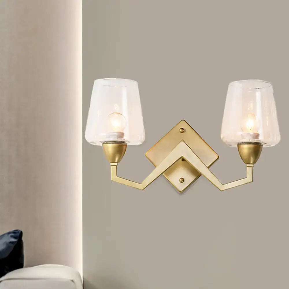 Mid-century brass wall lamp with truncated cone shade for bedroom