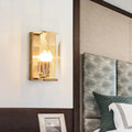 Mid century gold wall sconce with crystal shield for living room