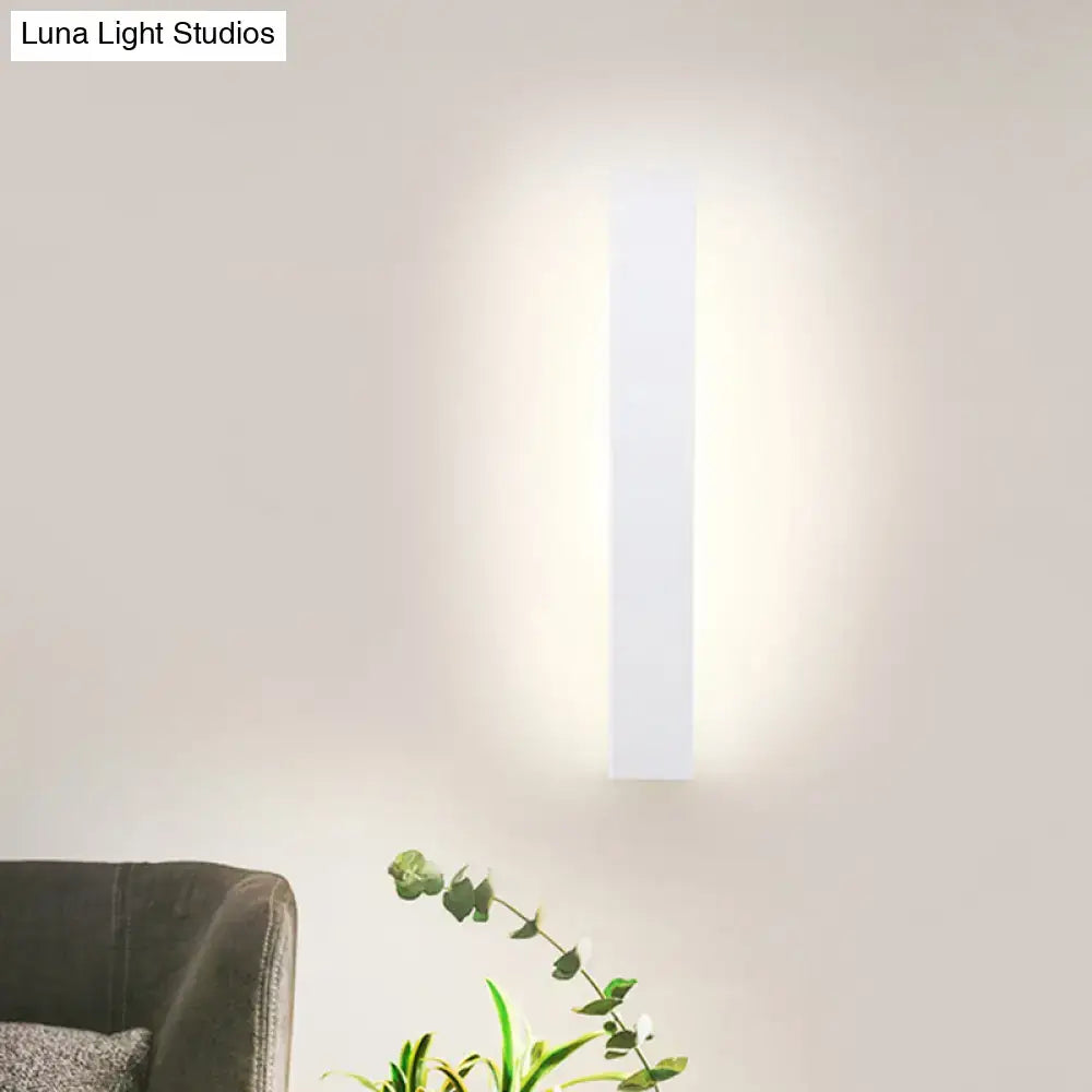 Minimalist black & white aluminum shade direct wired sconce bedroom