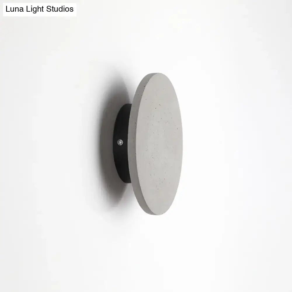 Minimalist cement grey flat round wall sconce light for bedroom