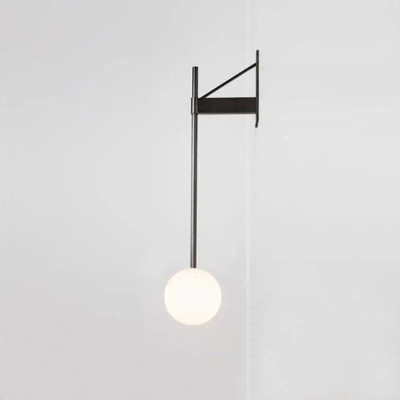 Minimalist geometric iron wall lamp with glass globe for bedroom