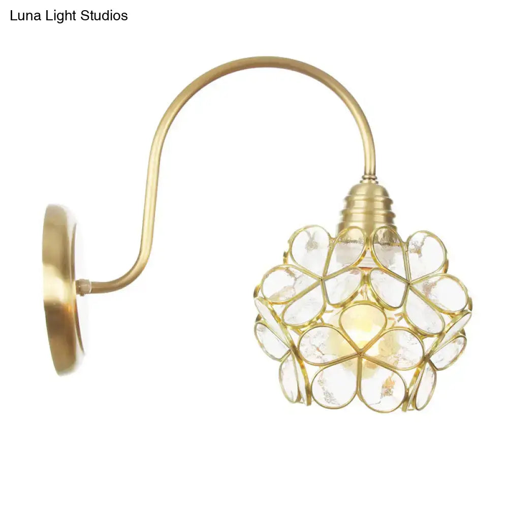 Minimalist gold floral wall sconce with glass shade for living room