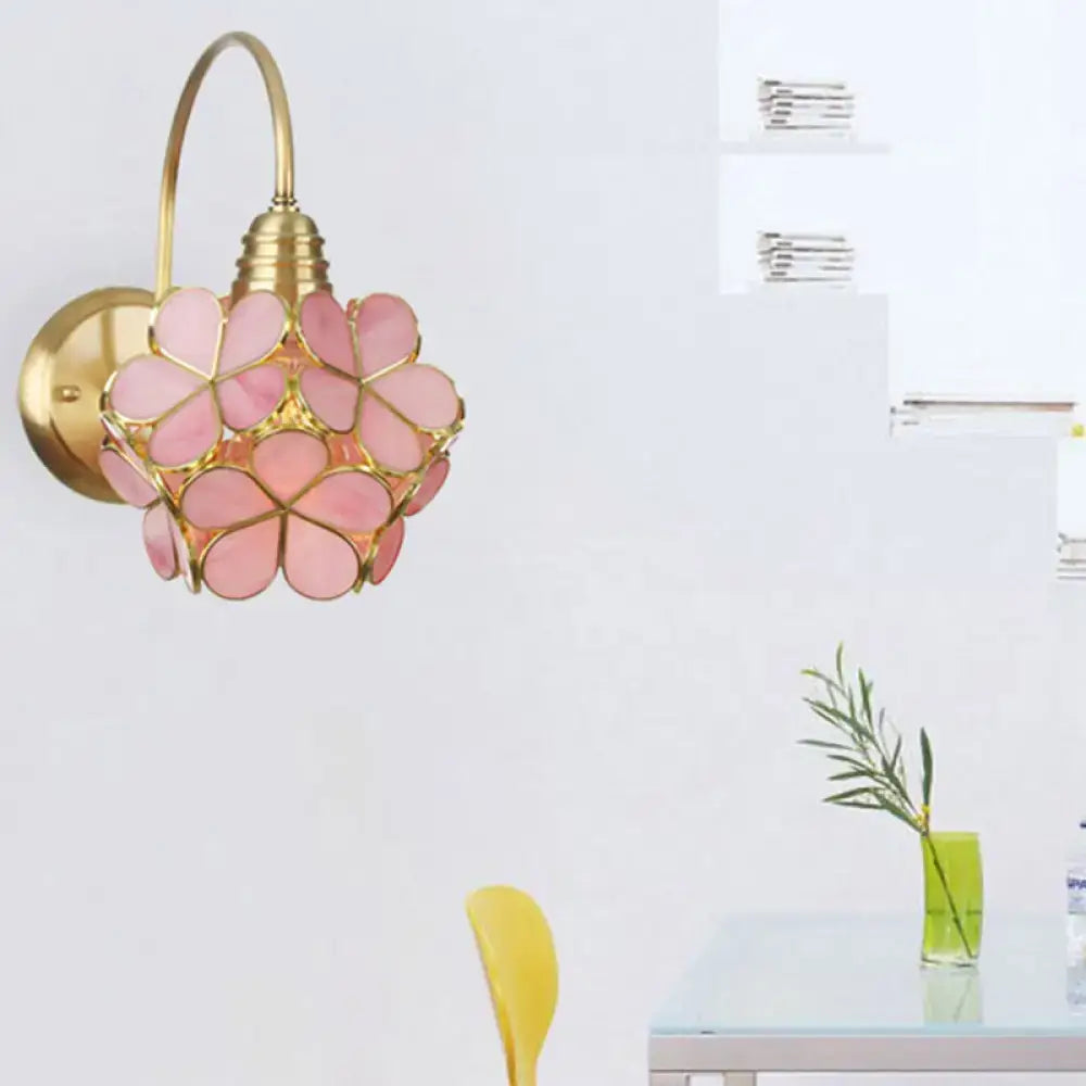 Minimalist gold floral wall sconce with glass shade for living room
