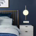 Minimalist gold wall light with white globe shade – bedroom sconce light