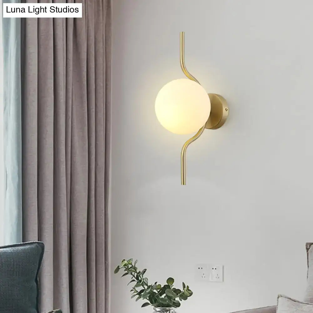 Minimalist gold wall light with white globe shade – bedroom sconce light