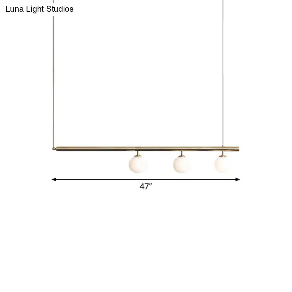Minimalist golden glass sphere pendant light dining room