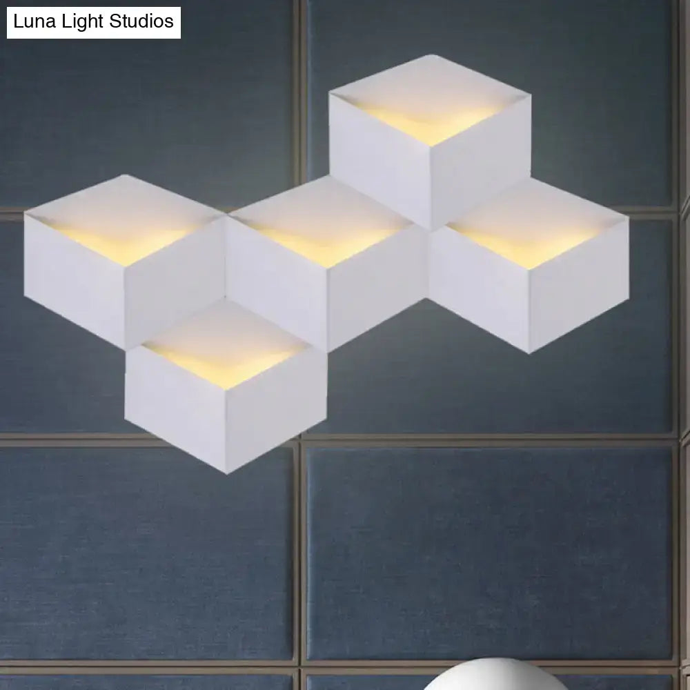 Minimalist white metallic geometric wall mount light for corridor