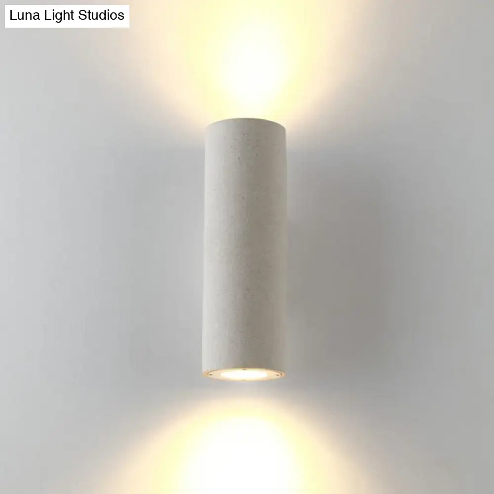 Minimalist white terrazzo stair wall sconce with compact fixture height