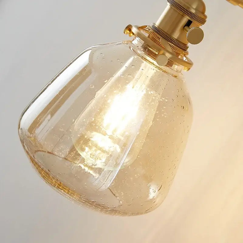 Modern amber clear glass wall sconce bedroom rotating brass lamp