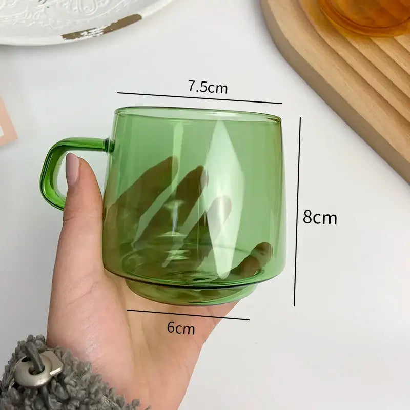 Modern amber glass coffee mug with black rim for kitchen dining room