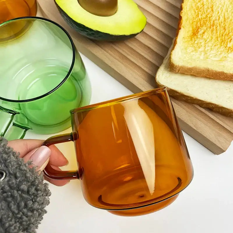 Modern amber glass coffee mug with black rim for kitchen dining room
