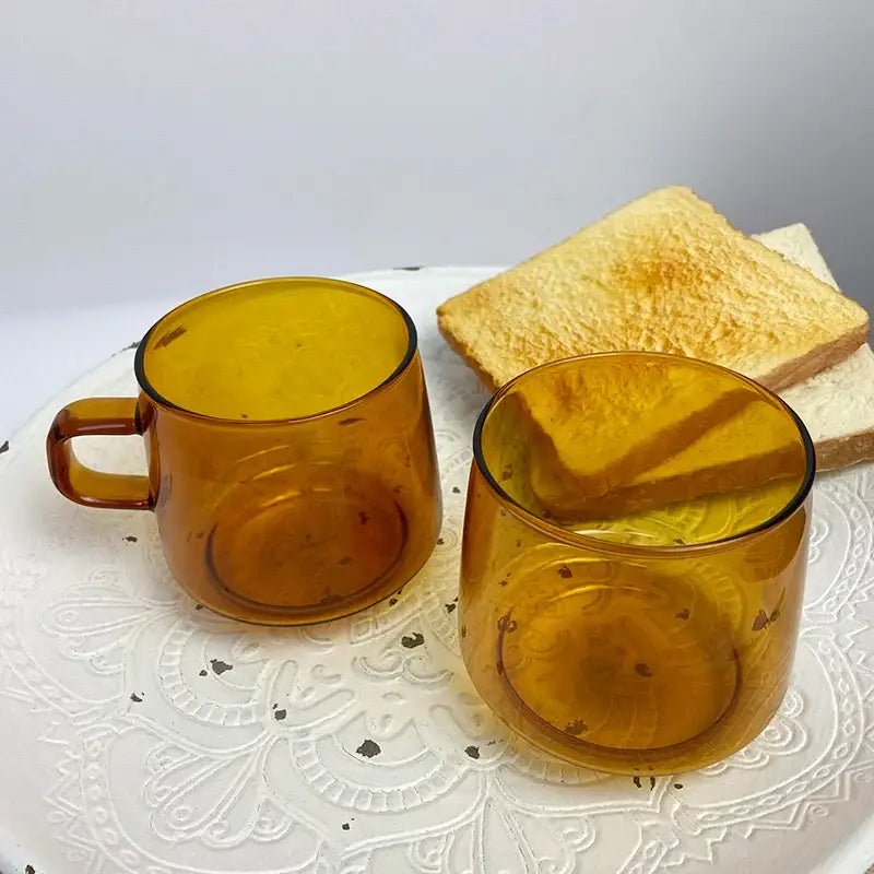 Modern amber glass coffee mug with black rim for kitchen dining room