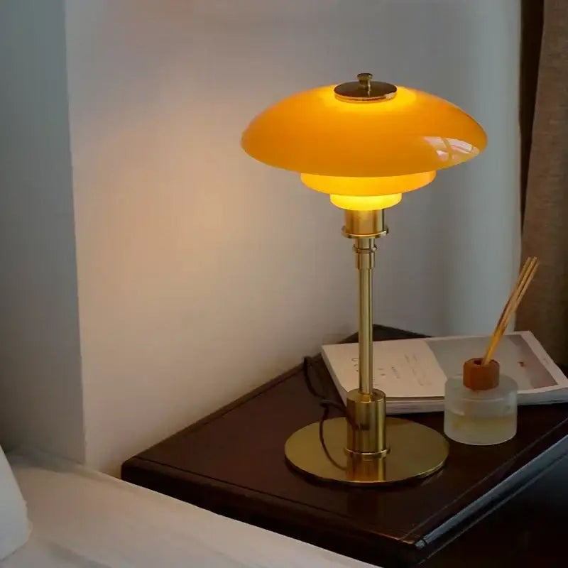 Modern amber glass desk lamp for living room with golden brass finish