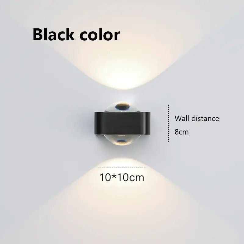 Modern black and copper bedroom wall lamp with glass dome