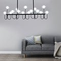 Modern black ceiling light with clear glass globe – dining room