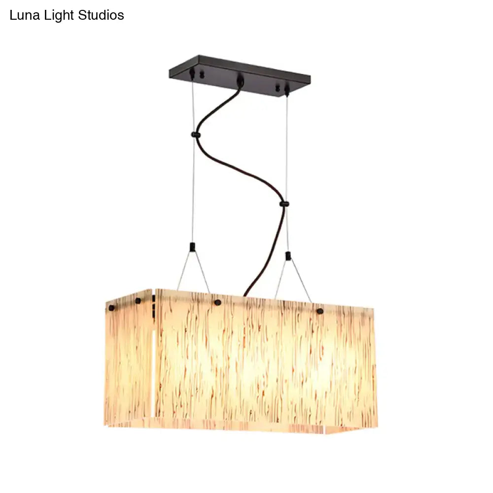 Modern black dining room pendant light with amber glass shade