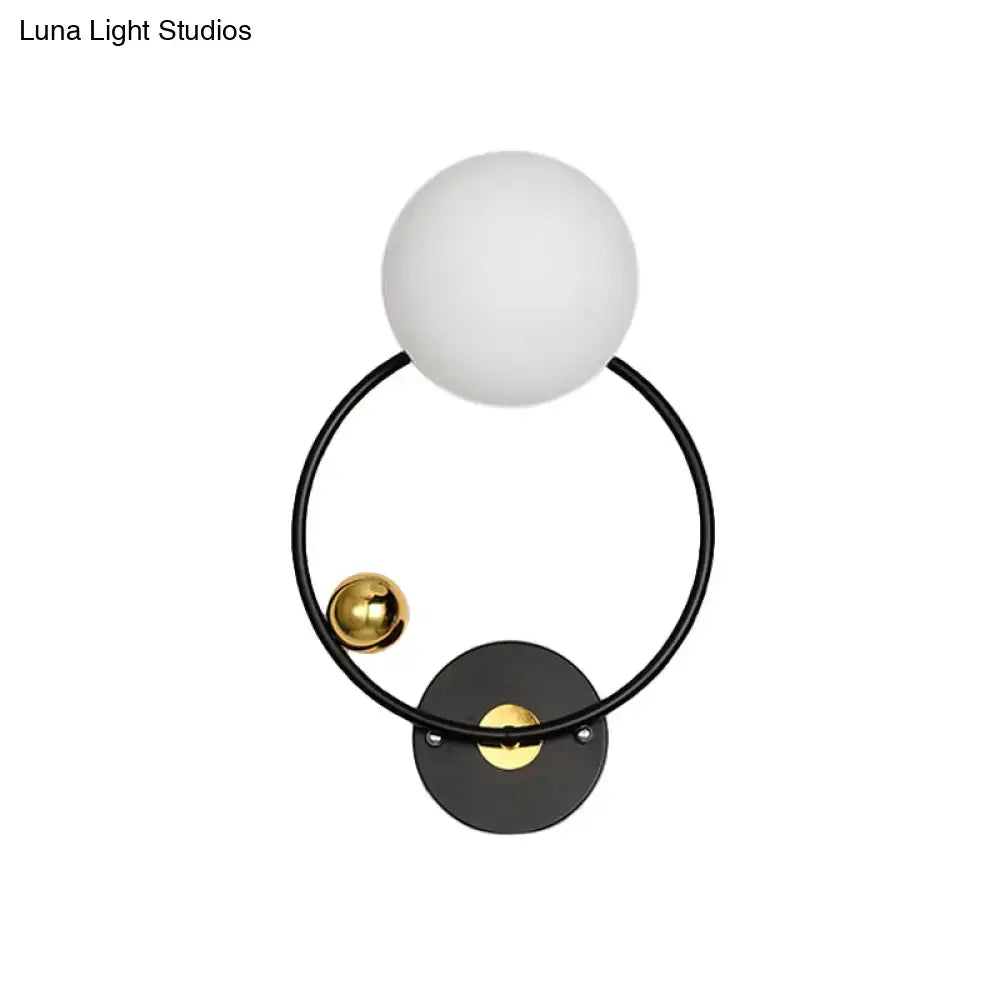 Modern black & gold wall sconce light with opal glass shade bedroom