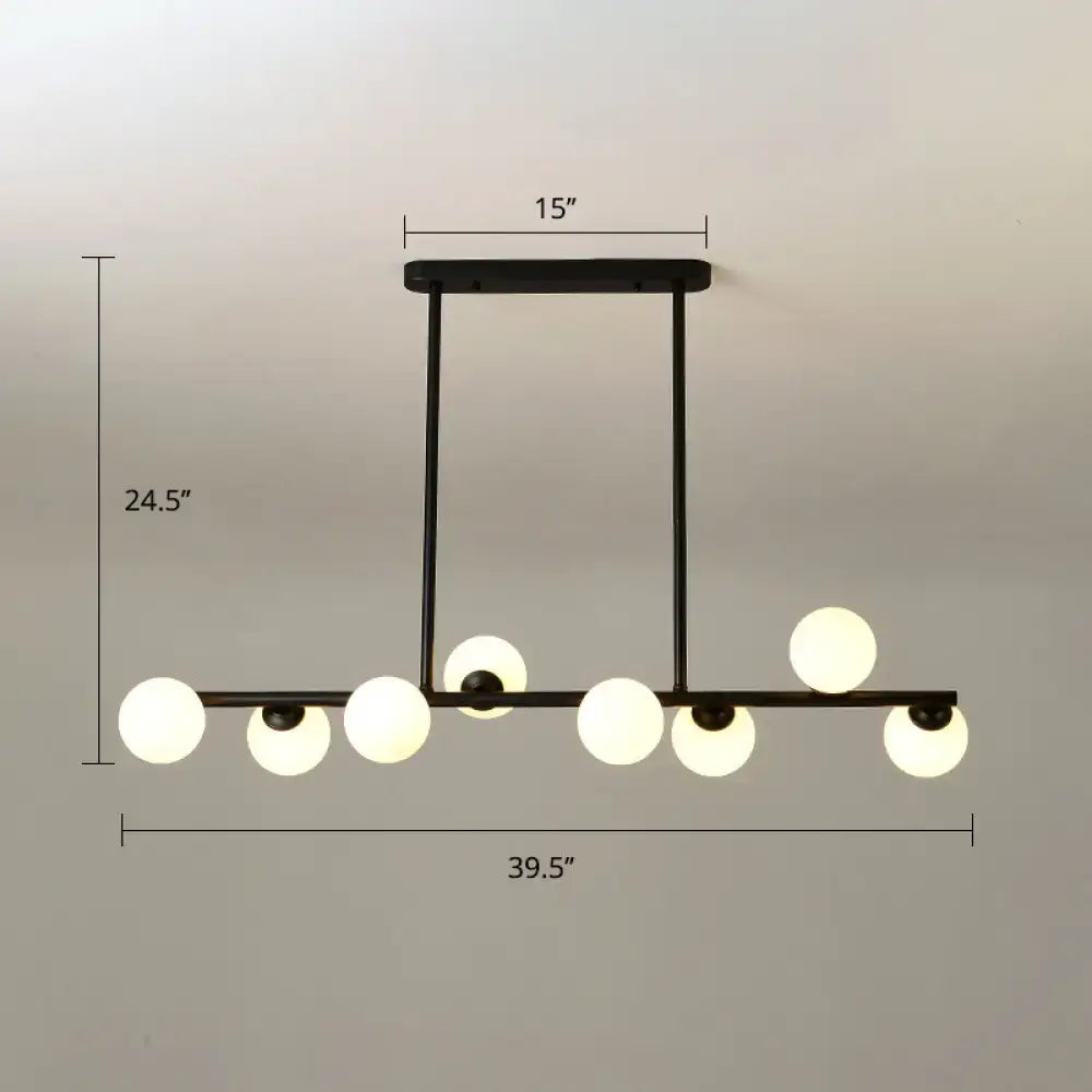 Modern black island ceiling light with frosted globes dining room