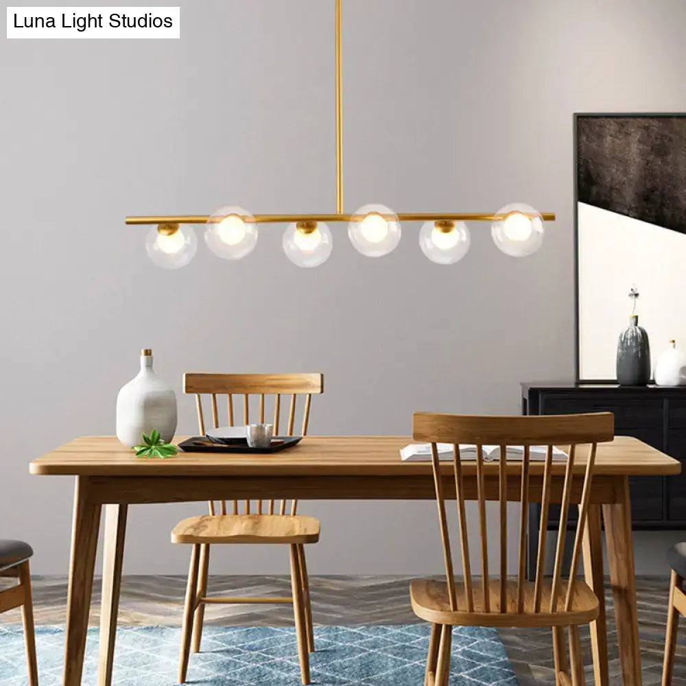 Modern black island pendant with clear glass globes dining room