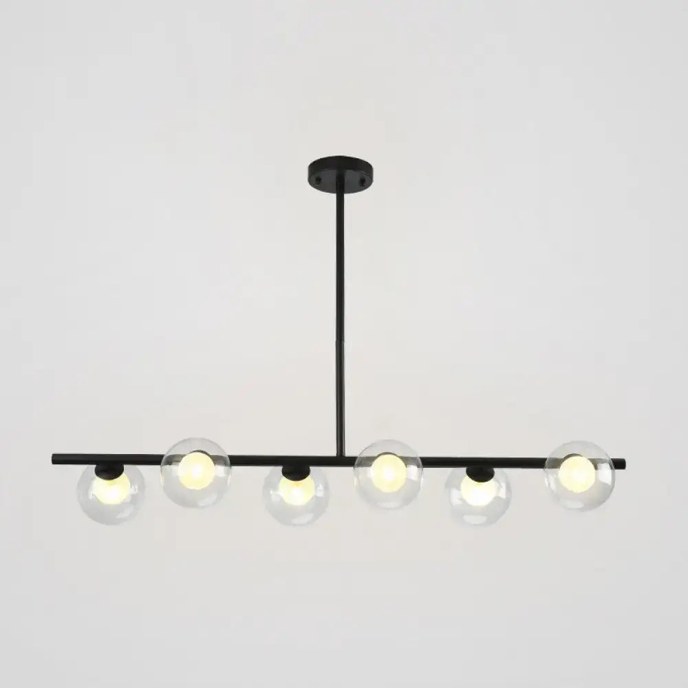 Modern black island pendant with clear glass globes dining room