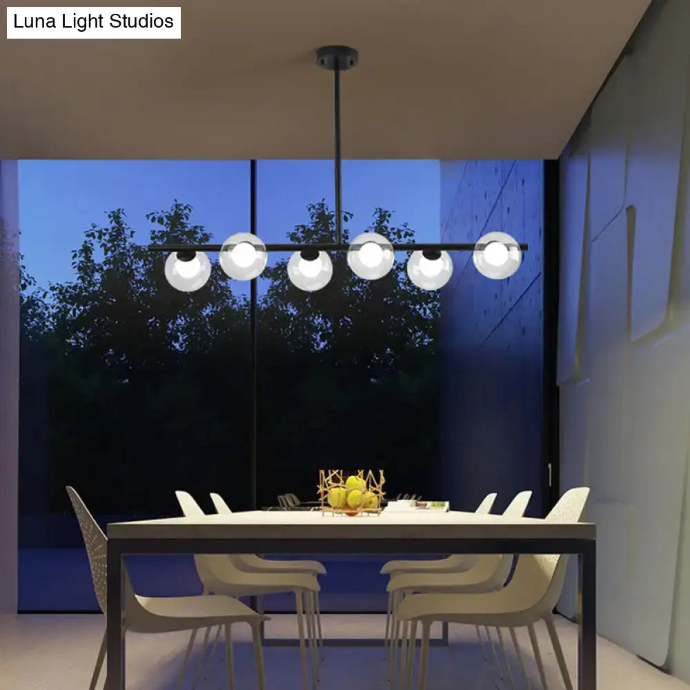 Modern black island pendant with clear glass globes dining room