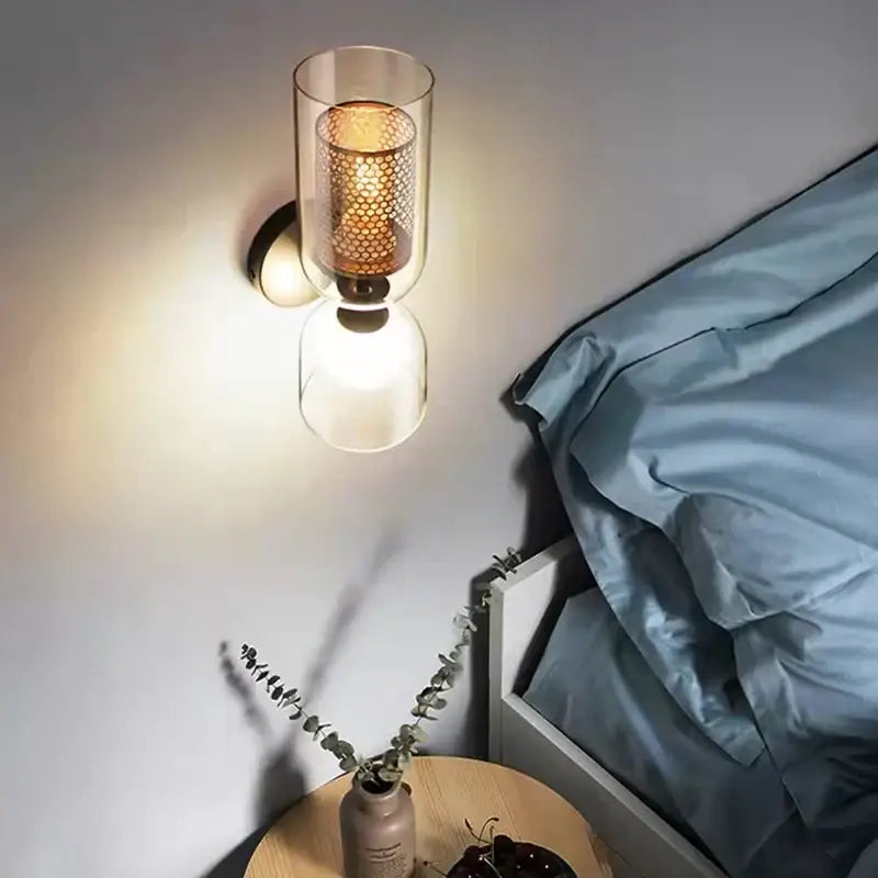 Modern black metal wall light with clear glass – bedroom sconce