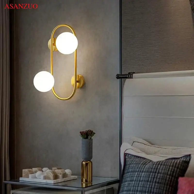 Modern black wall sconce with frosted glass globes – bedroom light