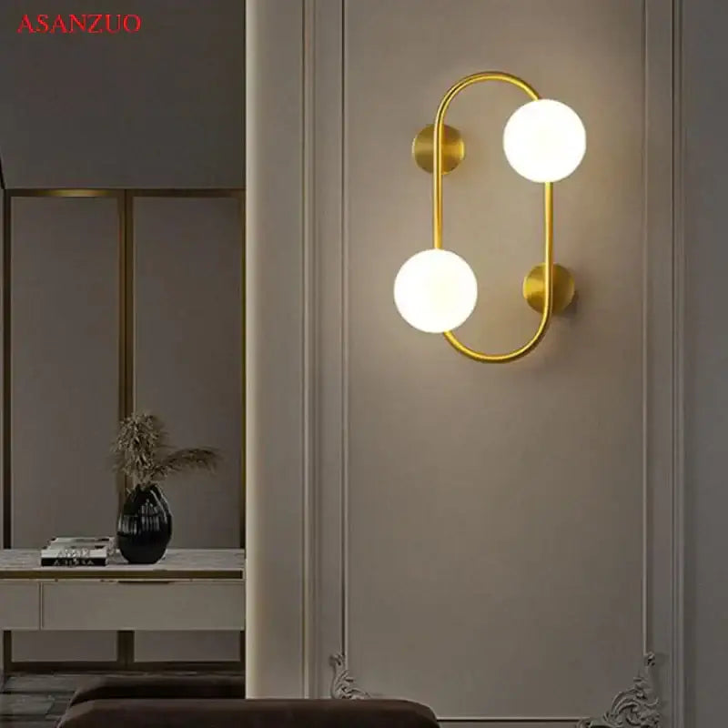 Modern black wall sconce with frosted glass globes – bedroom light