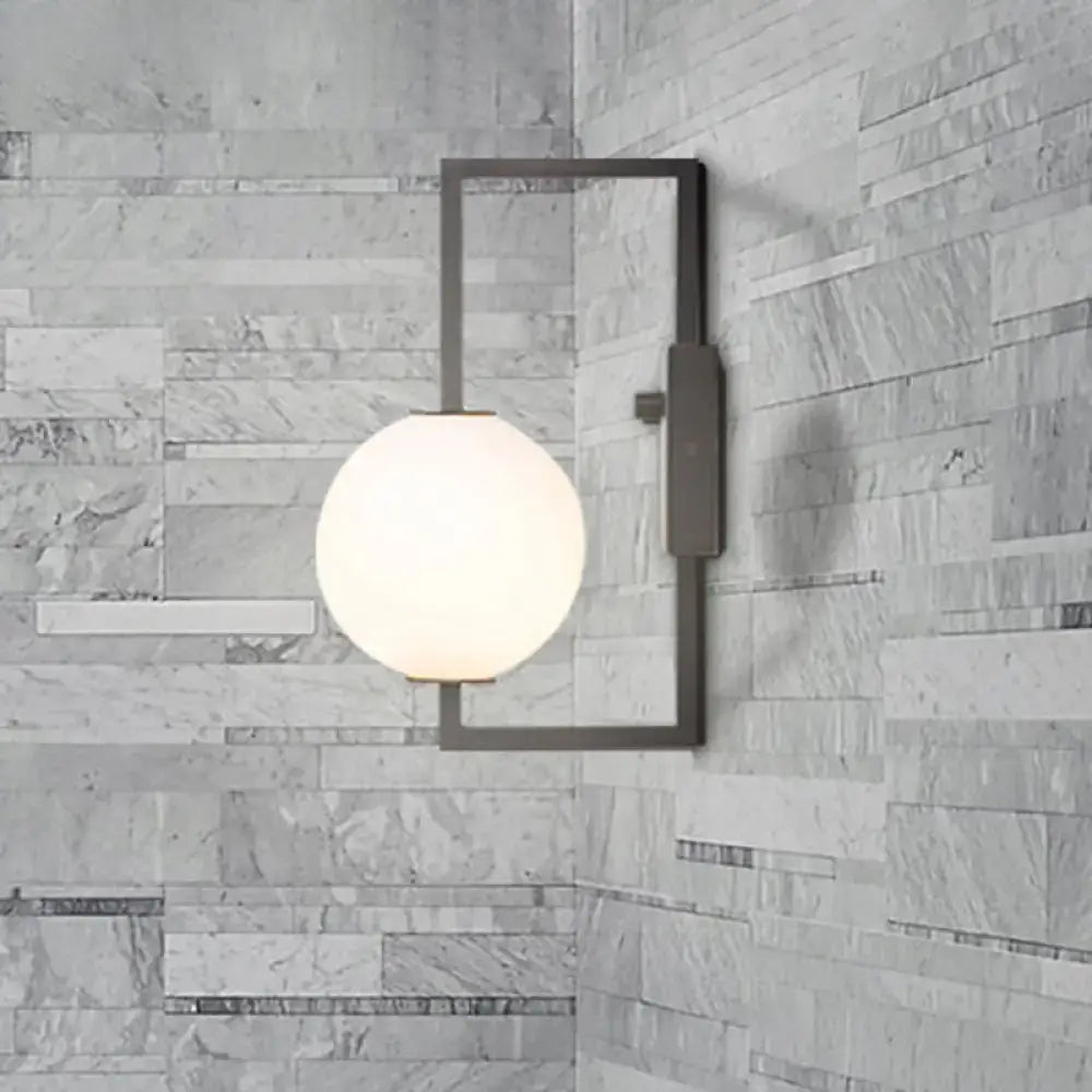 Modern black wall sconce with white glass orb – bedroom light