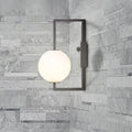 Modern black wall sconce with white glass orb – bedroom light