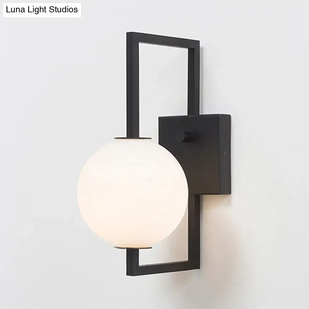 Modern black wall sconce with white glass orb – bedroom light