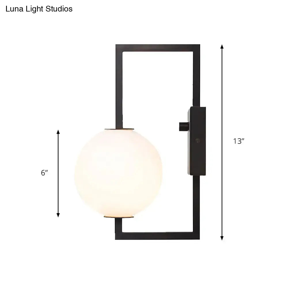 Modern black wall sconce with white glass orb – bedroom light