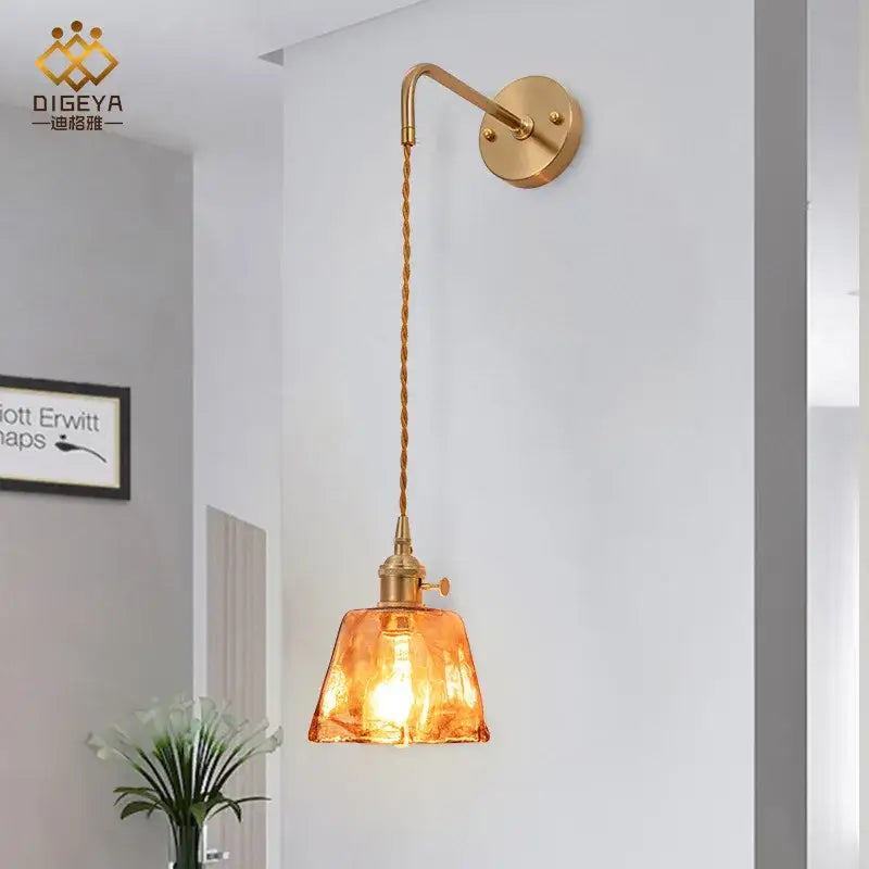 Modern brass and amber glass wall lamp for bedroom living room