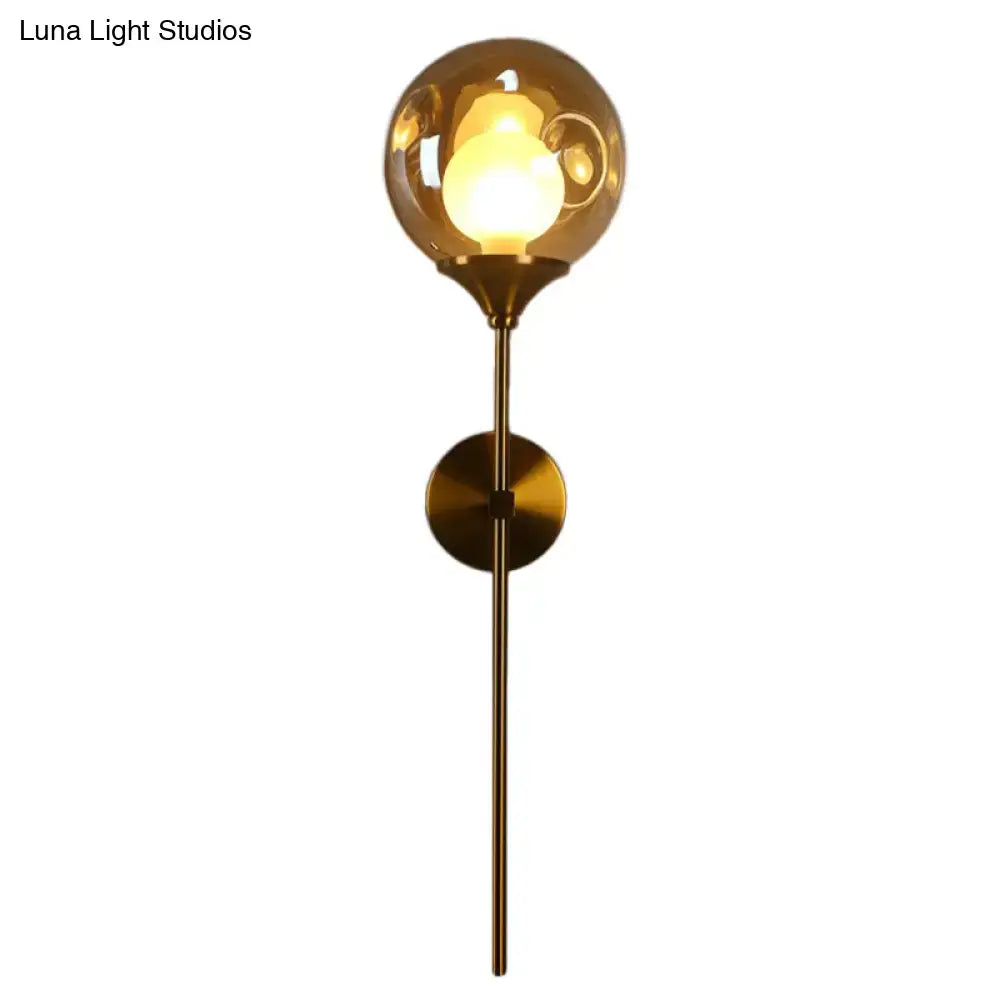 Modern brass and smoke gray glass wall light bedroom sconce