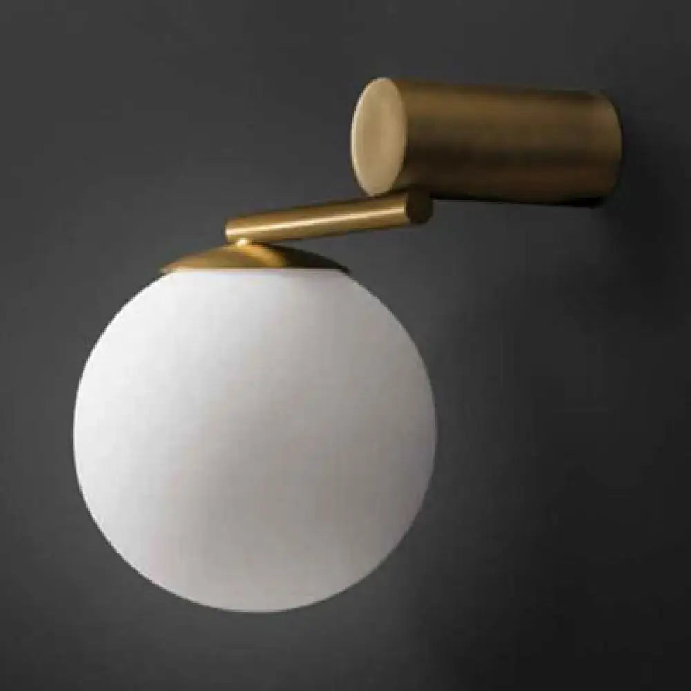Modern brass and white glass sphere wall sconce bedroom light