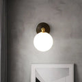 Modern brass and white glass wall sconce – bedroom globe light