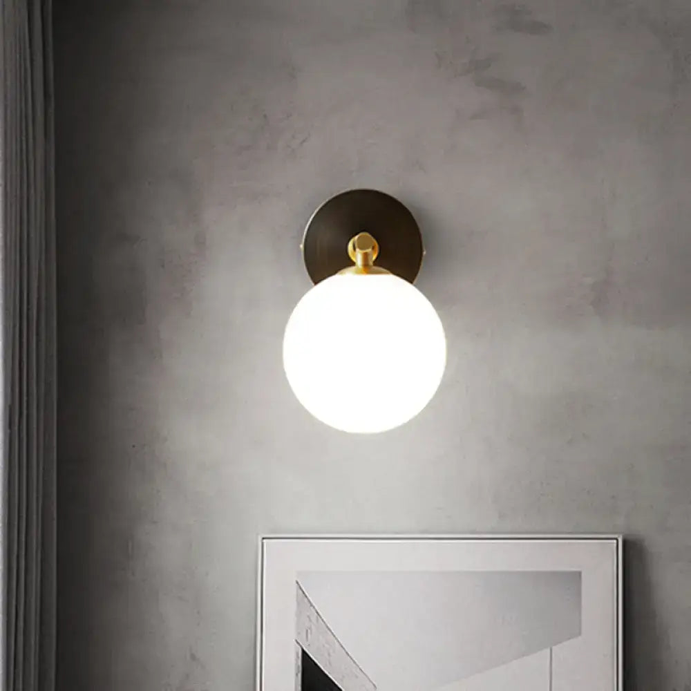Modern brass and white glass wall sconce – bedroom globe light