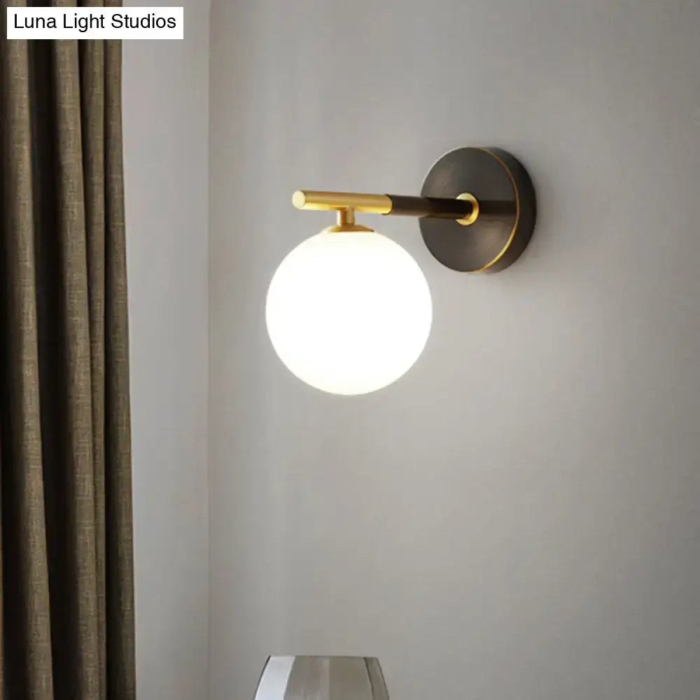 Modern brass and white glass wall sconce – bedroom globe light